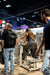 Athlete using the Gluteleader Standing Abductor GL-1005 at a fitness exhibition